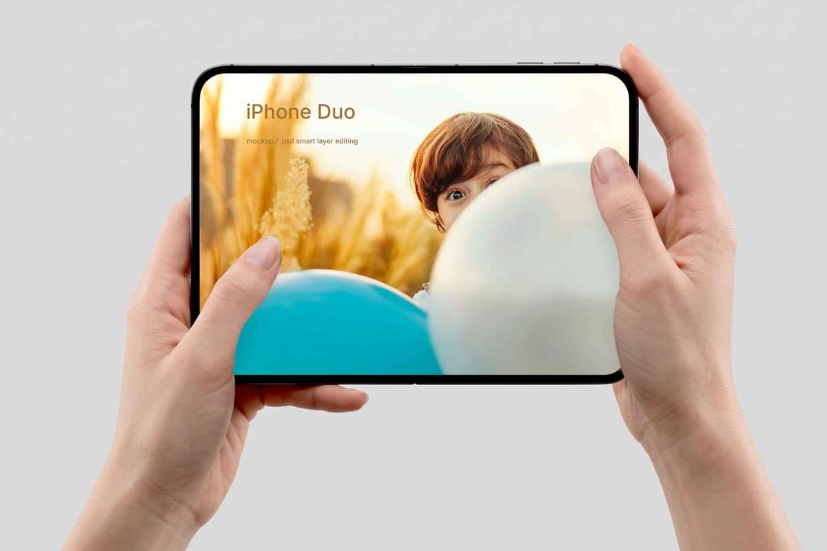 Open iPhone Duo Mockup Held in Hands